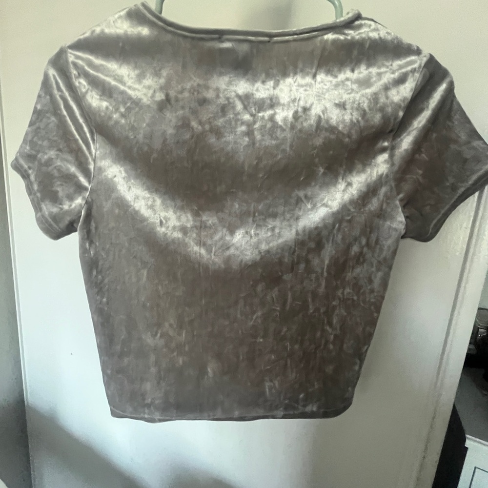 Very cute silk soft shirt. It says “Angel” and can be styled very cute!.